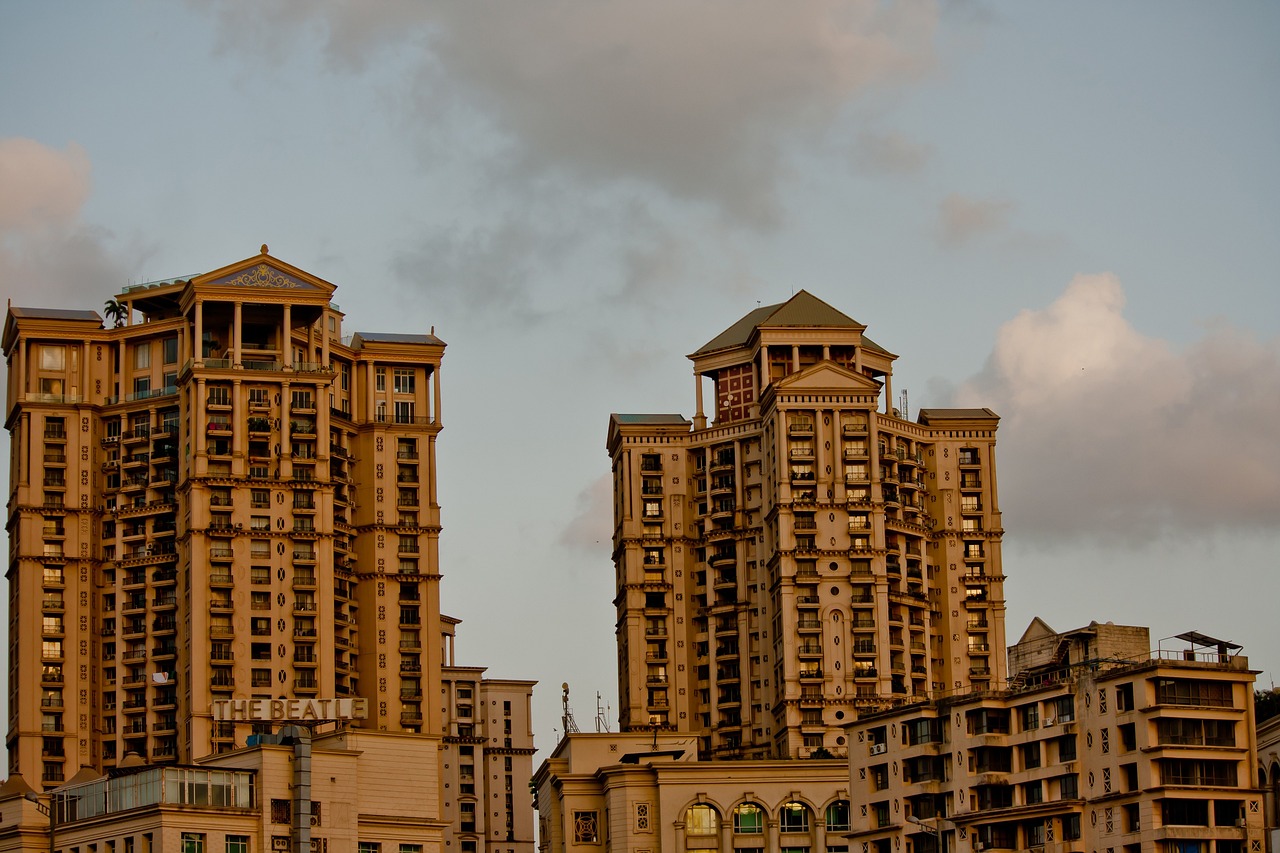 Tall residential towers on the Mumbai skyline at dusk